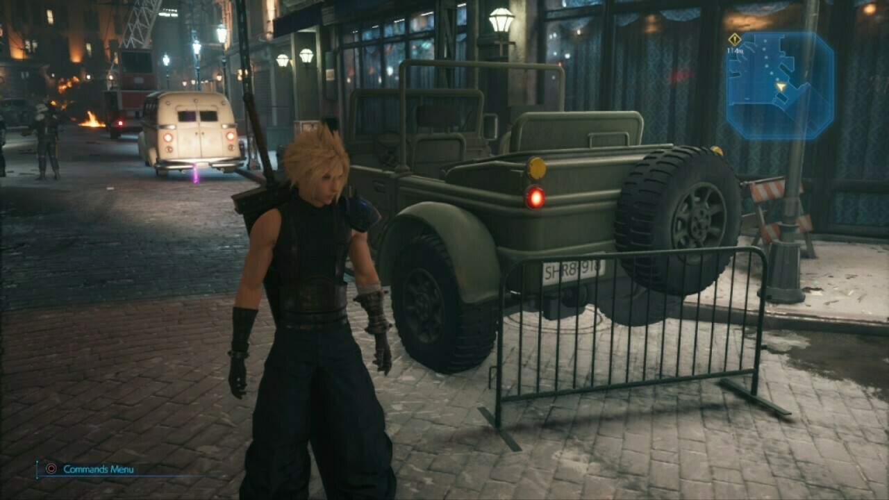 An in-game screenshot of a man with spiky blond hair and a large sword standing in front of a green jeep-style vehicle.
