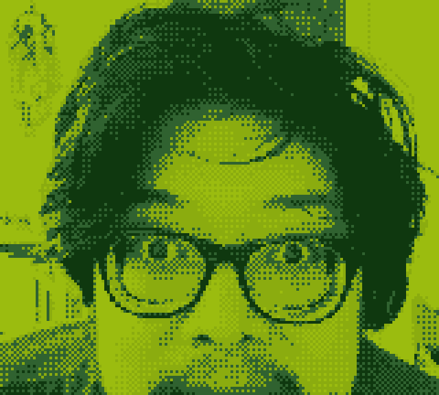 Halftone-style game boy camera style portrait of person with glasses and wavy hair rendered in bright lime green and dark forest green dots, creating a vintage pop art effect with high contrast and pixelated texture.